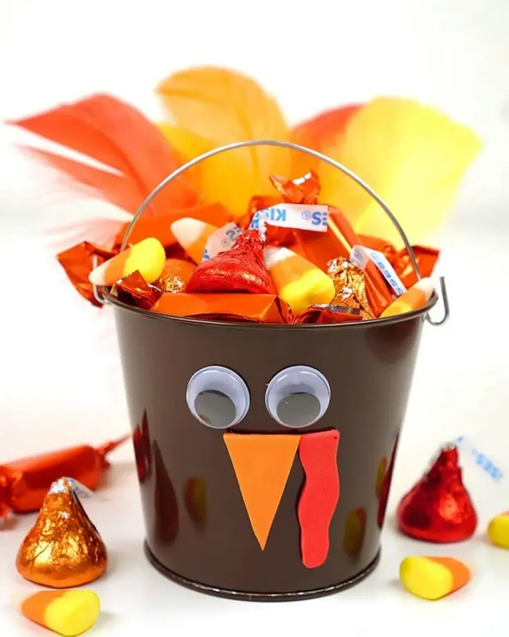 Whether you are celebrating Thanksgiving or Halloween, this craft is suitable for both occasions! It is a variation from the Turkey Windsock craft, which uses a tin pail as its base. This makes it the perfect craft to pair with the Turkey Windsock.