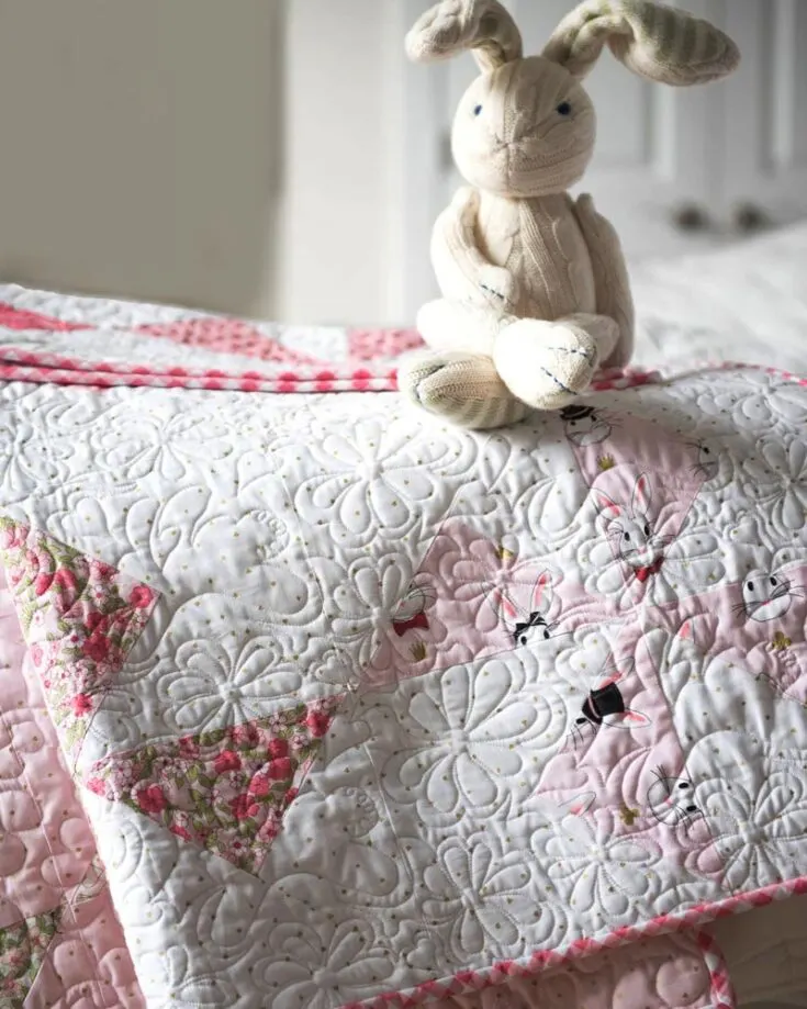 Learn how to make an easy turnstile quilt block with this simple baby quilt project! This pattern is great for beginners; the finished size is approximately 45&rdquo; x 45&rdquo;. Sew up a snuggly quilt blanket for your newborn baby with this easy baby quilt pattern!