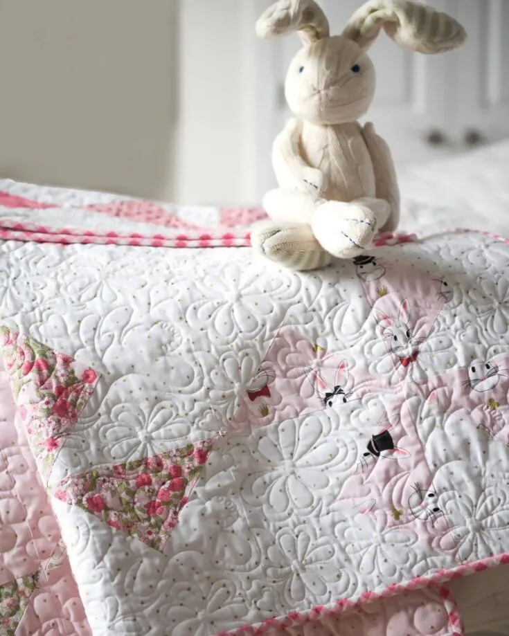 Planning on attending a baby shower soon? Or are you welcoming a new addition to the family? Learn to quilt this gorgeous and soft pink Turnstile Quilt Block for your tiniest tots. This delightful pattern offers a blend of simplicity and creativity that is so calming to the eyes. This pattern yields a 45&rdquo; x 45&rdquo; baby quilt.