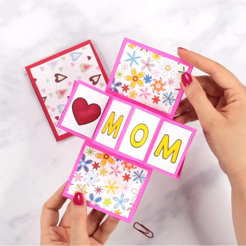 This twist and pop card offers such a different vibe to the classic wishing cards. With just a few simple folds and a sprinkle of creativity, you&rsquo;ll create a masterpiece that will make Mom&rsquo;s heart skip a beat. Customize it even more with cute doodles and decor by using colorful markers.