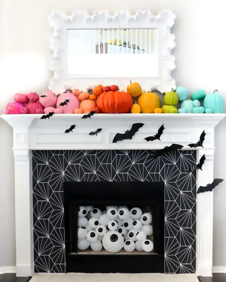 For homeowners who have a fireplace and are unsure what to do with it this Halloween, transform it into a spooky galore! It's so easy as it also comes with a printable template, so all you have to do is stick it on!