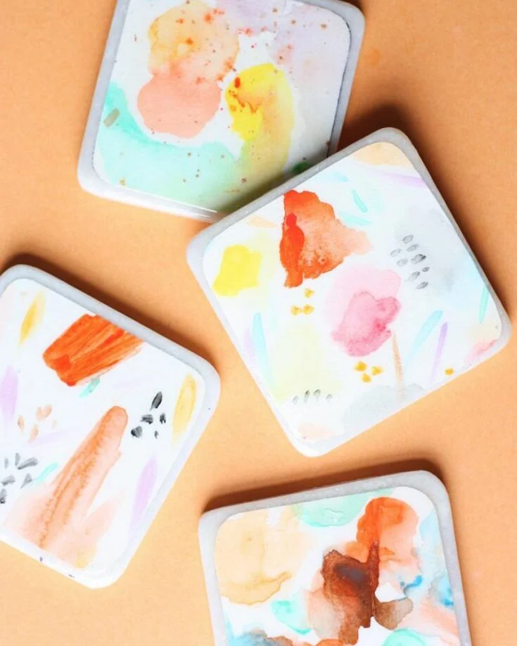 Bring a splash of color to your coffee table with watercolor coasters sealed with Mod Podge for a lasting finish! This project suits kids and adults, as painting with watercolors is simple and can be a fun experience for all!