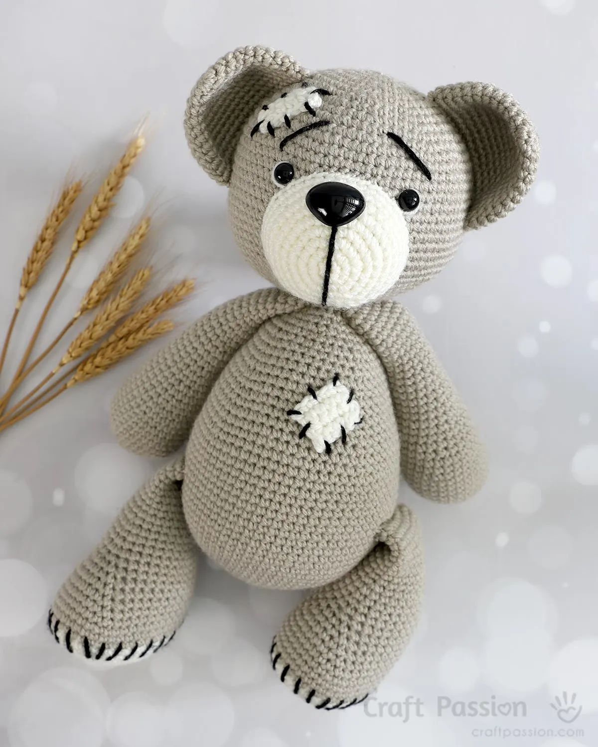 free crochet bear pattern named Tad, with mending patches and stitches