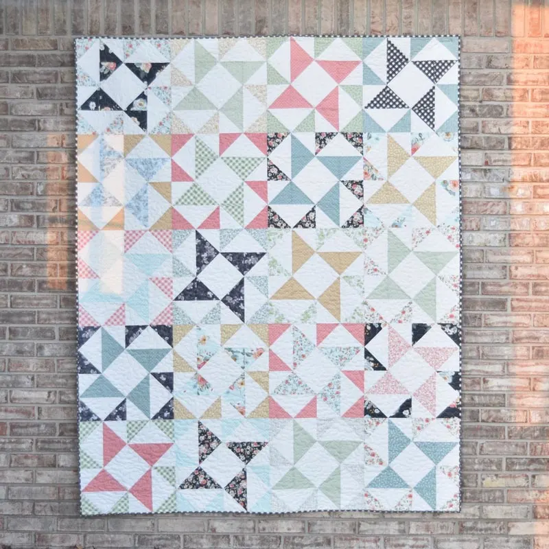 This tranquil Windmill layer cake design is so soothing to the eyes. It uses muted pastel colors and precise piecing of the half-square triangles (HSTs) to replicate a fun windmill shape! This 64&rdquo; x 80&rdquo; design is an ideal pattern for a twin-sized quilt and a delightful project for intermediate quilters.