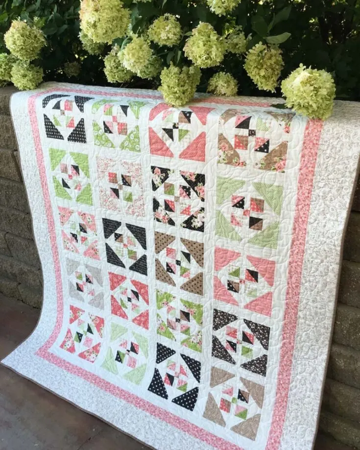 Have a look at this elegant and stunning Window Garden layer cake quilt pattern! Isn&rsquo;t it gorgeous? It&rsquo;s so calming to the eyes and combines simplicity with intricate floral designs. This inexpensive pattern is great for quilters of all levels to try, as it invites you to relax, unwind, and quilt a beautiful masterpiece for your home or as a thoughtful handmade gift. The finished size is 64 &frac12;&rdquo; x 76 &frac12;&rdquo;