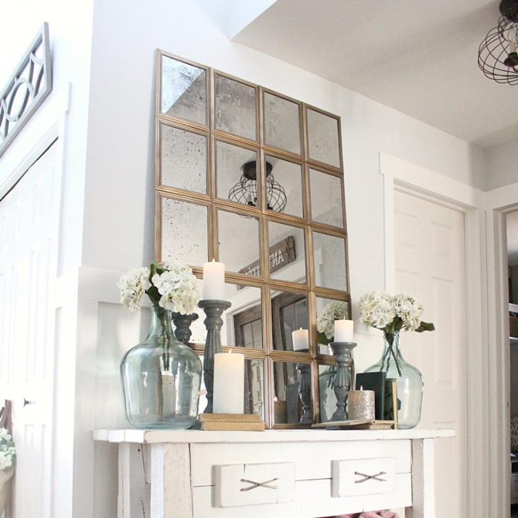 Create a stylish window pane mirror using affordable materials from the dollar store following this tutorial by Blooming DIYer. This unique decorative piece will add depth and character to any room in your home, while giving it a more elevated touch.&nbsp;