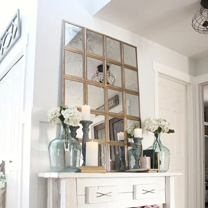 Create a stylish window pane mirror using affordable materials from the dollar store following this tutorial by Blooming DIYer. This unique decorative piece will add depth and character to any room in your home, while giving it a more elevated touch.&nbsp;
