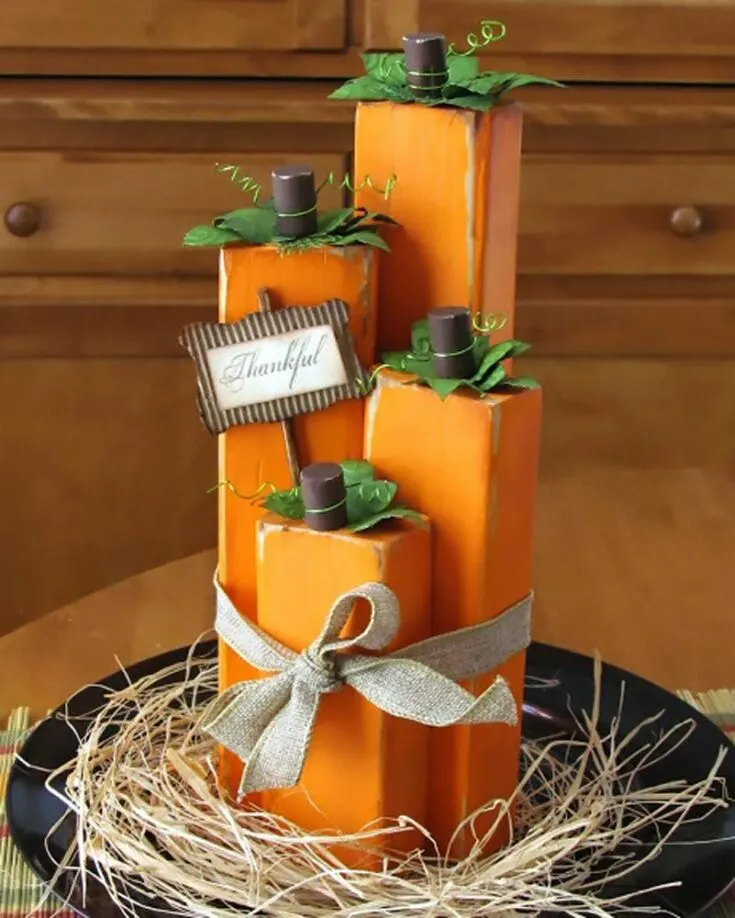 Check out these lovely wood block pumpkins that give your design a rectangular shape for a clean, sleek look. They&rsquo;re exceptional for your dining table decor and easy to make.