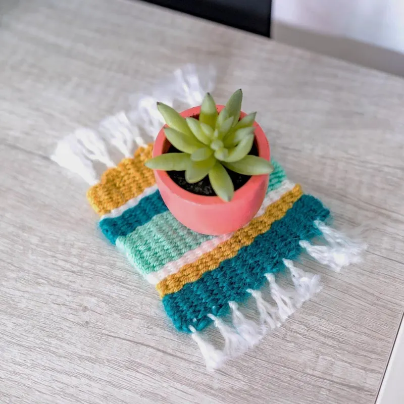 This project is essentially a tiny rug for your mug, and it is adorable! You can customize this at your own pace with any pattern or colors you prefer. Make a bigger one as a plant coaster or trivet for your pots and pans.